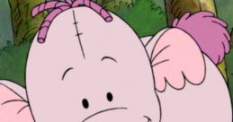 Cute pink elephant character with playful features, resembling a friendly creature from an animated children's show.
