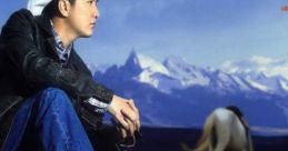 Man in cowboy attire sits pensively against a mountain backdrop, reminiscent of Capcom Fighting tracks themes.