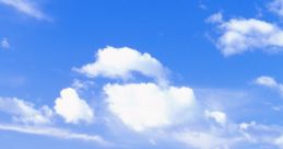 Vibrant green hills under a bright blue sky with fluffy white clouds, reminiscent of classic Windows backgrounds.