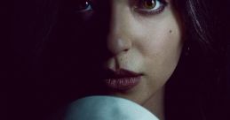 Amber Freeman, portrayed by Mikey Madison, holding a Scream mask, capturing the film's intense horror vibe.