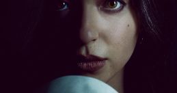 Mikey Madison as Amber from Scream 5, featuring an eerie expression and iconic ghost mask in a dark setting.