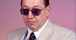 Gorilla Monsoon in a stylish suit and sunglasses, pointing assertively for an impactful photo. Classic wrestling persona.