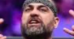 Eddie Kingston passionately gestures while wearing a "REDEEM" t-shirt, showcasing his intense persona in wrestling.