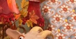 Curious puppet goat with big expressive eyes amidst autumn decorations, perfect for Mr. Lawnmower's whimsical adventures.