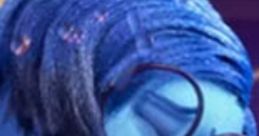 Sadness from Inside Out (2015) with blue hair and glasses, expressing deep emotion in a colorful setting.