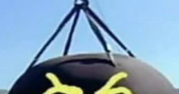 Wrecking ball with a menacing face design, suspended above a colorful construction site backdrop.