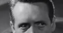 Patrick McGoohan in a classic black and white scene, exuding intense emotion and mystery in sophisticated attire.