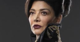 Chrisjen Avasarala, portrayed by Shohreh Aghdashloo, showcases a striking look in elegant black and gold attire.