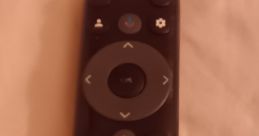 TCL remote control featuring Netflix, Amazon Prime, and YouTube buttons for seamless entertainment access.