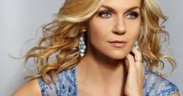 Rhea Seehorn showcasing glamour in a stunning blue dress, perfect for red carpet events and celebrity appearances.