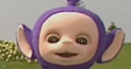 Tinky Winky from Teletubbies smiles playfully on a grassy hill, showcasing his iconic purple outfit and triangular antenna.