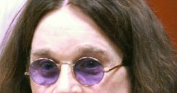 Ozzy Osbourne, renowned rock icon, with long hair and purple sunglasses, capturing his distinct style and persona.