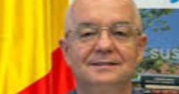 Emil Boc, Mayor of Cluj-Napoca, in front of a banner showcasing the city's cultural initiatives and flags.
