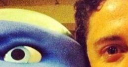 Jason Biggs poses with Leonardo, showcasing a fun moment with the animated character from the TMNT franchise.