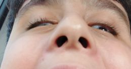 Child passionately yelling in a car, showcasing excitement and loudness with mouth wide open. Perfect for loud moments.