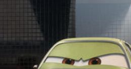 Acer from Cars 2, featuring a distinct green color and expressive eyes, ready for action in the race scene.