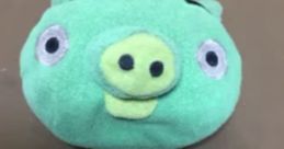 Cute green plush pig toy with big eyes, representing the Normal Minion Pig Error from popular mobile games.
