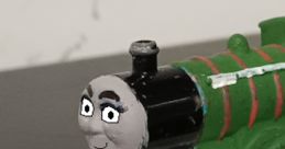 Cute green train toy inspired by Lucy & Bethany as Katie Jones from Bruno & Friends, featuring a playful face design.
