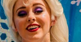 Elsa from Frozen, joyfully expressing herself at Disneyland Frozen Day, adorned in her iconic sparkling costume.