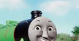 Smiling Henry the Green Engine on the tracks, showcasing his vibrant green color against a scenic background.