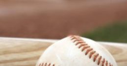 Baseball and bat resting on green grass, symbolizing the spirit of outdoor sports and teamwork in DYB Songs 2.