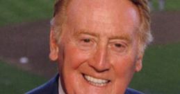 Vin Scully smiling, holding a Dodgers microphone, known for his legendary sports broadcasting career in baseball.
