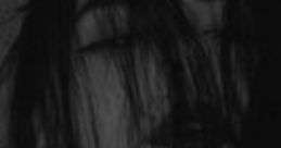 Moody portrait of a girl with long dark hair obscuring her face, embodying themes of mystery and psychological depth.