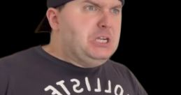 Angry expression from Louis Johnson, wearing a dark Hollister shirt, showing frustration and intensity in his demeanor.