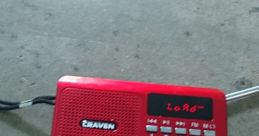 Red portable radio with digital display and buttons, ideal for Indonesian music and listening to HARAN broadcasts.
