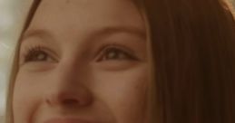 Joyful expression of Tiana Tracy, also known as PuffinLove, showcasing her radiant smile and long hair.