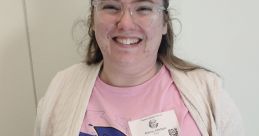 Kirrea Johnson wearing a Sonic the Hedgehog t-shirt, smiling, showcasing her vibrant personality at a public event.