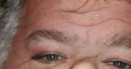 Close-up of a man with a neutral expression, showcasing facial features and light skin tones, capturing unique character.