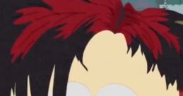 Goth kid with striking black and red hair looks pensive while sitting at a table with cigarette and ashtray.