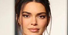 Kendall Jenner showcases stunning makeup and a glamorous gold dress at a recent event, exuding confidence and elegance.