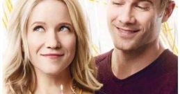 Couple celebrating with a cupcake and candle from "The Birthday Wish," a Hallmark movie airing January 21 at 9/8c.