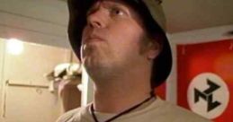 Skinhead in a shirt marked "WHITE," with a cross necklace, reflecting themes from "Skinheads USA: Soldiers of the Race War.