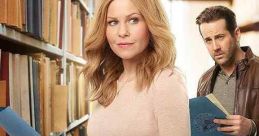 Aurora Teagarden and a companion investigate in a library setting for "An Inheritance to Die For," premiering August 11.