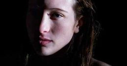 Close-up of a woman with striking features and wet hair, evoking intrigue and emotion, related to "Beautiful Kate" (2009).