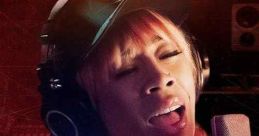 Keyshia Cole passionately singing in the studio for "This Is My Story" documentary, showcasing her musical journey.