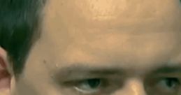 Close-up of a man with short hair, serious expression, highlighting intense gaze and features. Relevant to Andreas_usw_GER topic.