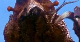 Ebirah, the giant crustacean monster, emerges from the ocean, showcasing its menacing claws and distinctive features.