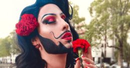 Eden Darling Eden Darling is a vibrant and charismatic Spanish bearded drag queen who captivates audiences with her