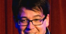 Michael McIntyre performing on stage, engaging the audience with humor and charisma during a live comedy show.