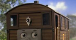 Toby the Tram Engine smiles as he travels along the tracks, showcasing his unique design and playful personality.