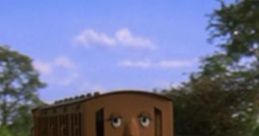 Annie the character from TATMR on the tracks, displaying a sad expression amidst a scenic landscape.