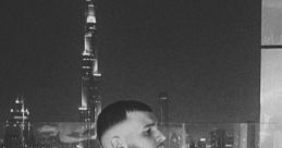 Thoughtful moment captured with Dubai skyline at night, reflecting modern lifestyle and urban sophistication.