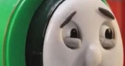 Percy the Small Engine smiles brightly, showcasing vibrant green detailing in this playful Robot Chicken portrayal.