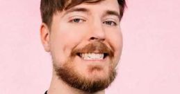 MrBeast smiles while wearing a black shirt with a colorful "BEAST" logo, showcasing his gaming brand's style.