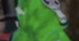 Bright green avatar in a playful pose, reminiscent of J3vu trolling vibes in a gaming environment.