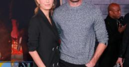 Armie Hammer and co-star pose at event, showcasing their stylish looks and event atmosphere related to Cars 3.